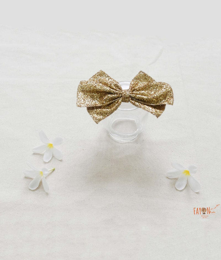 Manufactured by FAYON KIDS (Noida, U.P) Golden Glitter Bow Clip