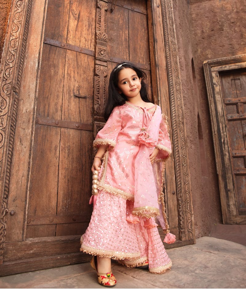 https://www.fayonkids.com/cdn/shop/files/manufactured-by-fayon-kids-noida-u-p-peach-sequence-embroidery-kurti-sharara-for-girls-39074051916032.jpg?v=1686404314