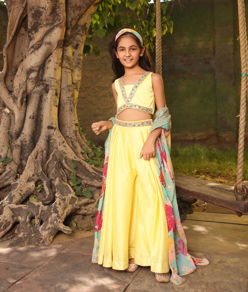 https://www.fayonkids.com/cdn/shop/files/manufactured-by-fayon-kids-noida-u-p-yellow-crop-top-with-pant-and-printed-cape-for-girls-39074100674816.jpg?v=1686403411